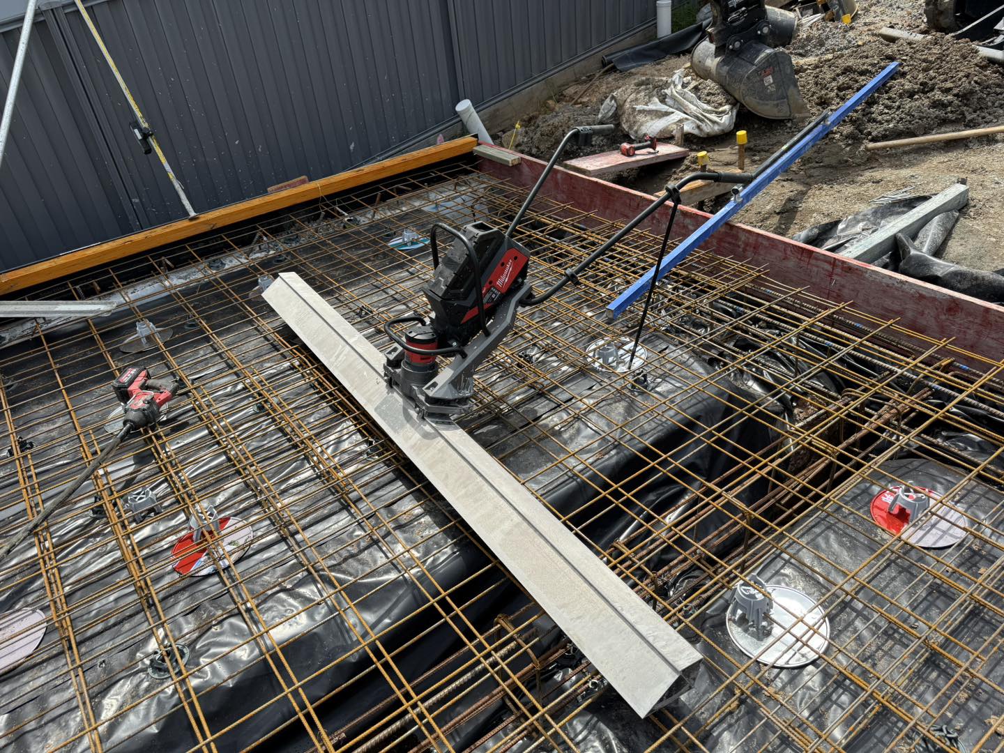 Heavy rebar mesh grid with laser level ready for pour